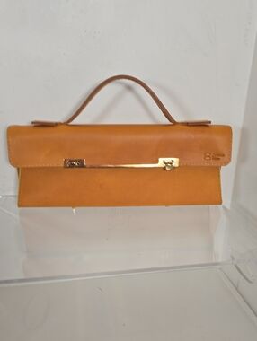 Classic Tan Leather Top-Handle Clutch with Gold Bar Accent